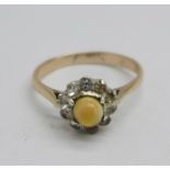 A yellow and white metal set opal and white stone cluster ring, 2g, M, (acid tests as 9ct gold and