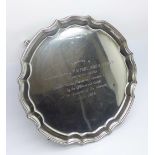 A silver salver on four feet, with RAF related inscription dated 1964, 290g, diameter 20.5cm