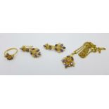 An Eastern yellow metal wedding jewellery suite, pendant, earrings and matching ring, O, all