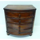 A modern miniature mahogany bow front chest of four drawers, 24cm