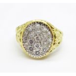 A gentleman's 18ct gold and diamond ring, 12.6g, S, oval top 13mm x 15mm, (mark worn, small crack on