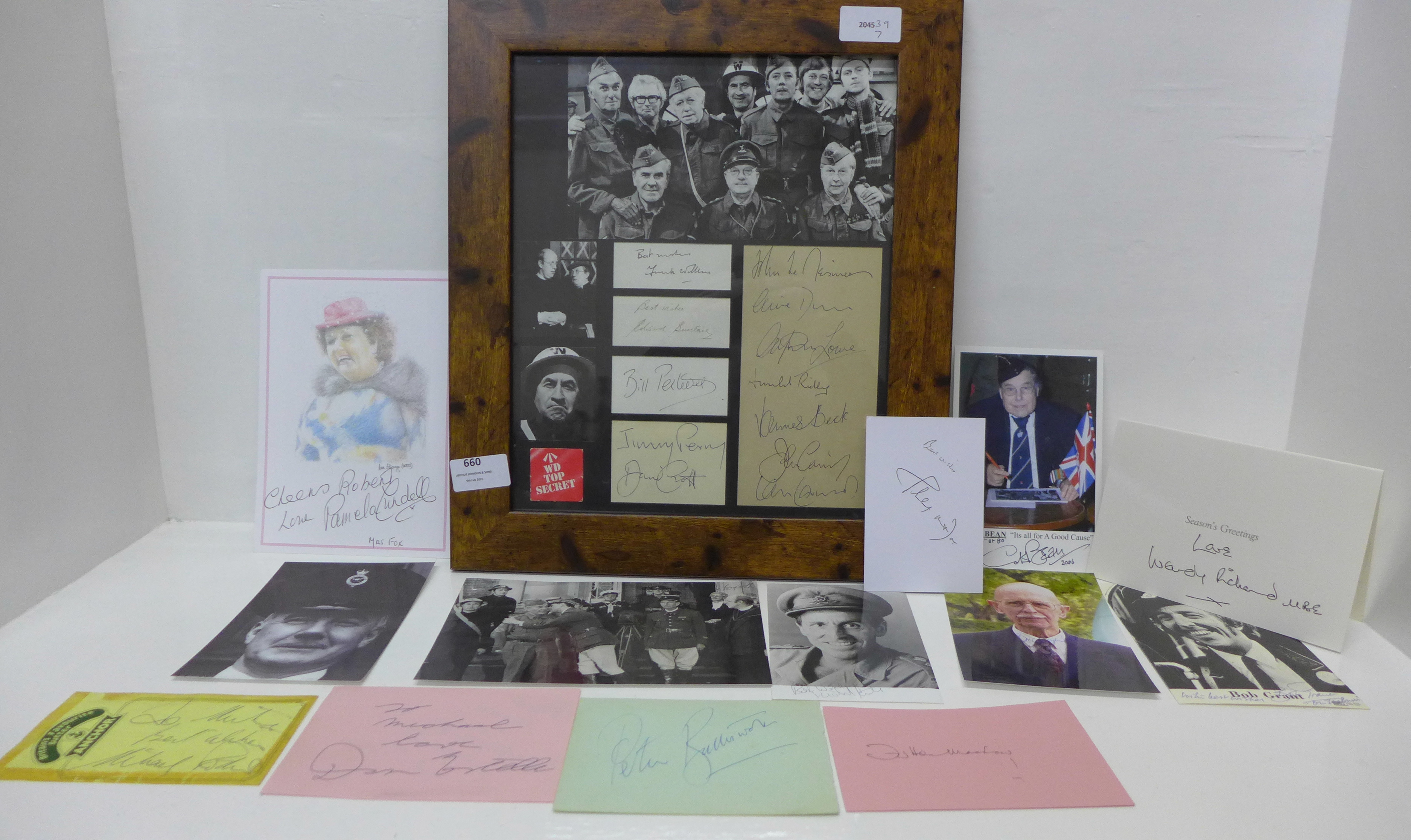 A framed Dad's Army montage of signed photographs with autographs and cast photographs plus a