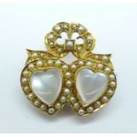 An early 20th century 15ct gold seed pearl and moonstone double heart brooch, 6.6g, width 28/29mm