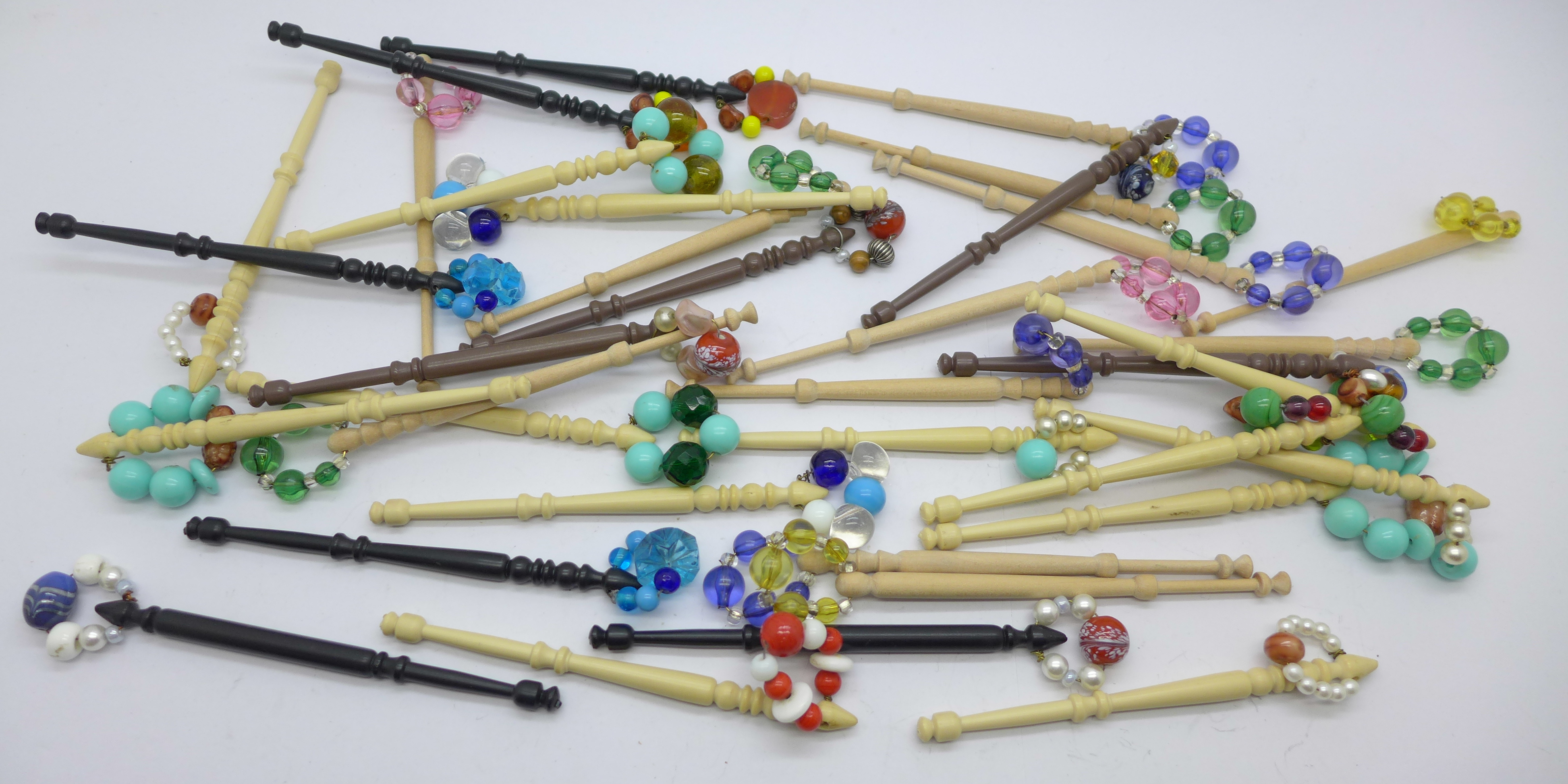 Thirty-five lace bobbins