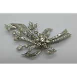 A large white metal set diamond spray brooch, set with round brilliant cut, pear shaped, marquise