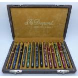 Fourteen Conway Stewart fountain pens, boxed in a Dupont collectors case, thirteen with 14ct gold