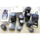 Six Olympus camera lenses including Zuiko digital ED 70-300mm, 200mm F4, 35mm, 28mm, 135mm,