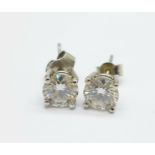 A pair of 9ct white gold set moissanite ear studs, each approximately 1ct