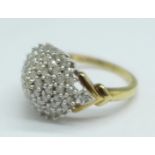 A 9ct gold, diamond cluster ring, 1carat diamond weight marked on the shank, 3.5g, P
