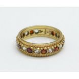 A 9ct gold, red and white stone eternity ring, 3g, K