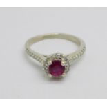 A white metal, diamond and red stone cluster ring, 2.9g, P