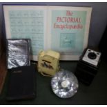 A Coronet Ambassador camera, a novelty spirit flask, two Bibles including a 1953 Commemorative issue