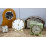 Five clocks including a mounted Smiths car clock