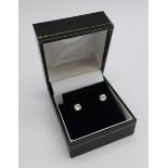 A pair of 18ct white gold and diamond stud earrings, total diamond weight 0.67ct