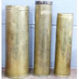 Three military brass shell cases, 105mm (1978) and 2x 75mm (one 1944)