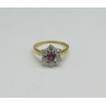 An 18ct gold, ruby and diamond cluster ring, 3.9g, O