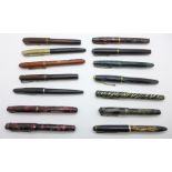 A collection of vintage fountain pens, five with 14ct gold nibs
