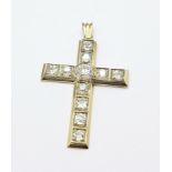 A yellow and white metal set diamond cross pendant, with approximately 3ct total diamond weight,