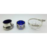 A silver mounted glass wine taster, London 1917, and two silver salts with blue glass liners