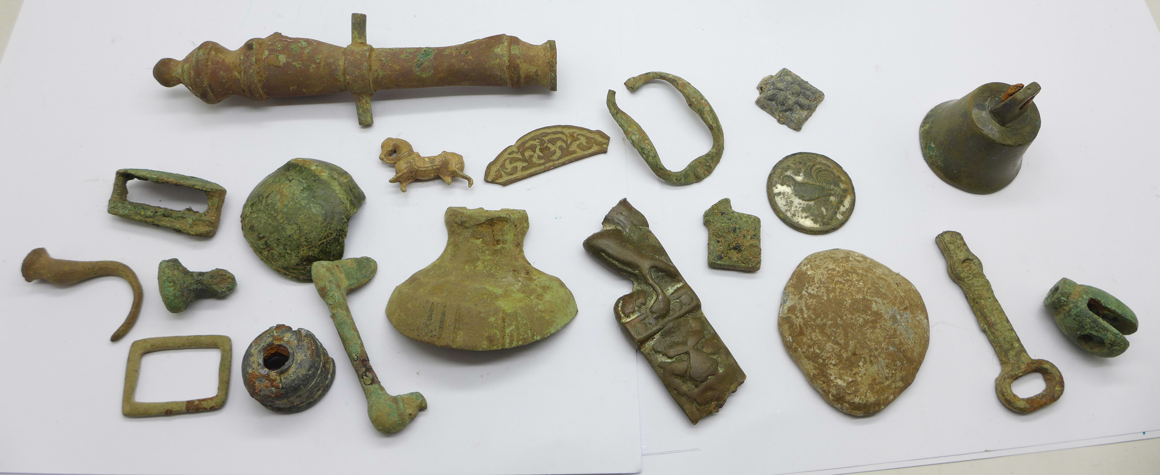 A collection of metal detecting finds including bronze