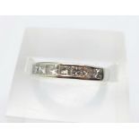 A platinum and seven stone princess cut diamond ring, 5.5g, L