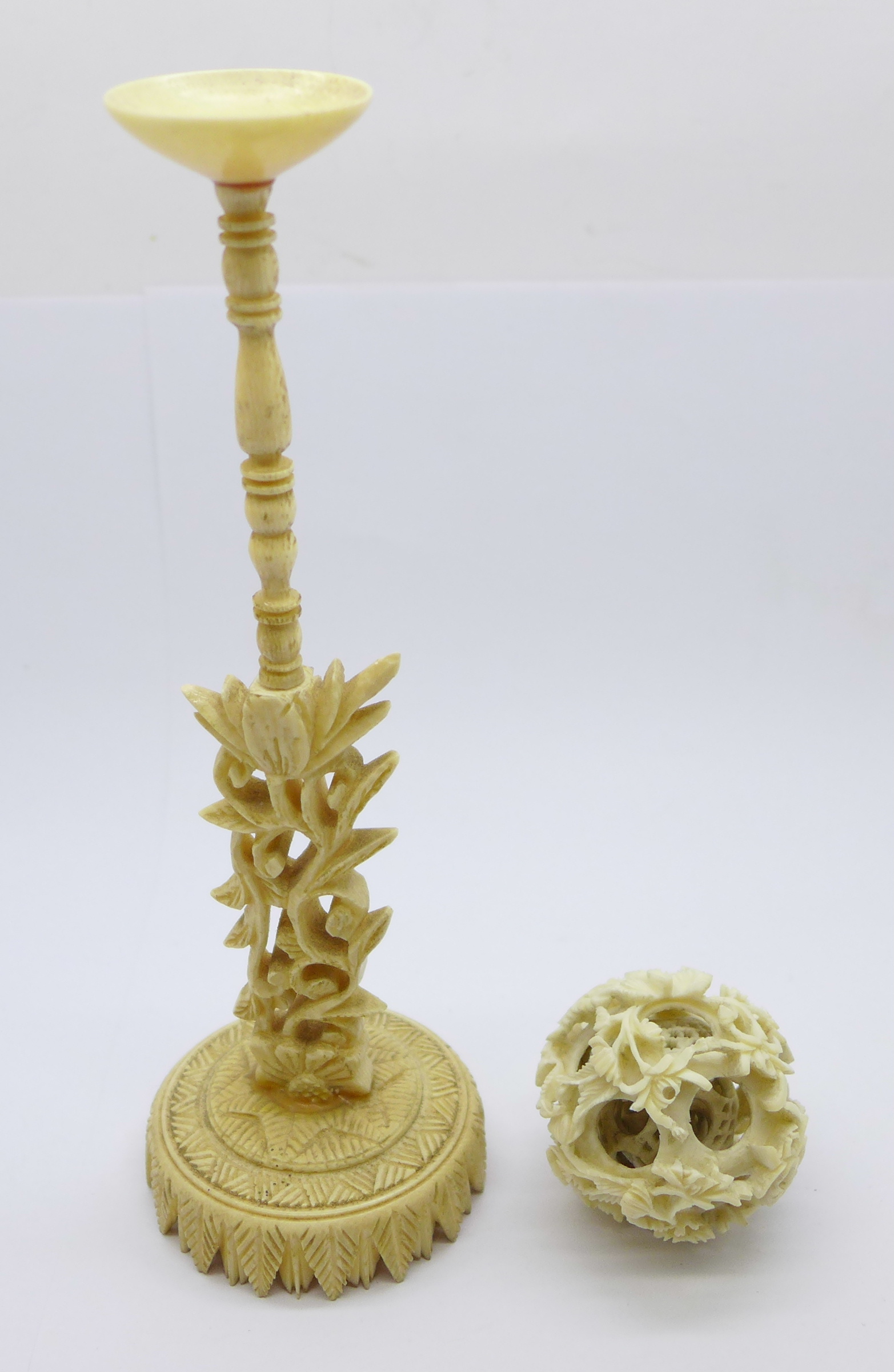 A bone puzzle ball and stand (both a/f, ball broken internally and stand re-glued in two places)