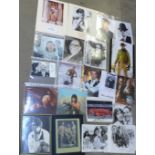 A collection of autographs; Arnold Schwarzenegger, Sylvester Stallone, Dan Ackroyd, Angelina