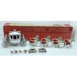 A Coronation Coach and Horses set by Lesney, boxed and two smaller models