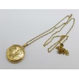 A 9ct gold locket and chain, 5.4g, locket 18mm