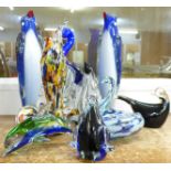Nine items of coloured glass; two similar Murano penguin vases, a Murano fish vase, three birds, a