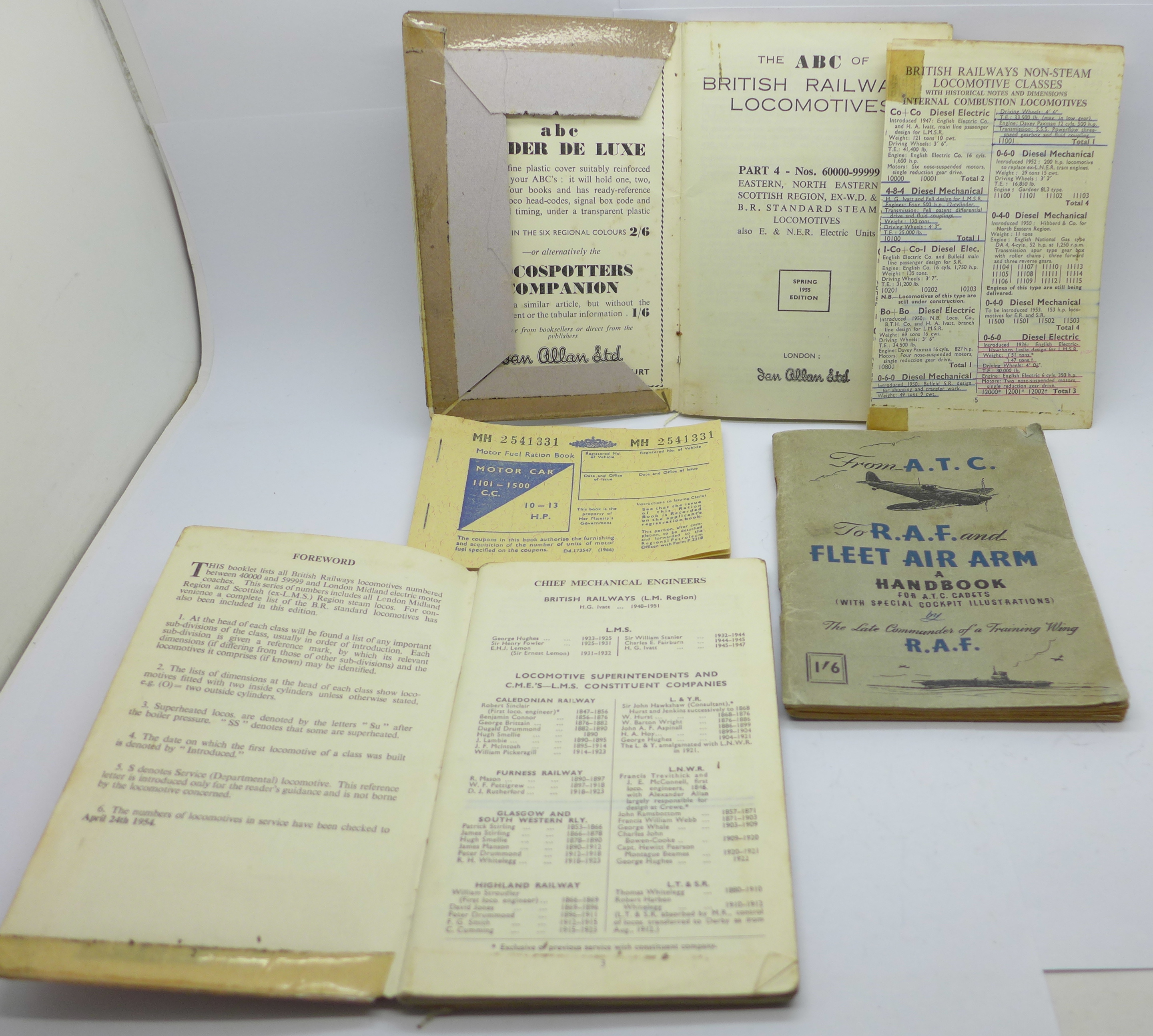 An ATC, RAF, FLEET AIR ARM handbook, two railways booklets and a Motor Fuel Ration Book