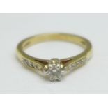 A 9ct gold and nine stone diamond ring, 3g, P, main stone approximately 0.25carat weight