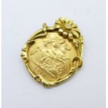 A George V 1914 half-sovereign in a 9ct gold Art Nouveau pendant mount, total weight 6.7g