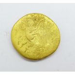 A gold tone coin, 30mm