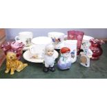 A decorated cranberry glass beaker, a cranberry coloured glass jug and a bowl, children's tea