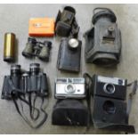 A pair of binoculars, field glasses, cameras, and lamps including a R Broadhurst Dreadnought tail