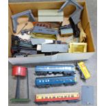 A collection of model rail; buildings, locomotive in parts, etc.