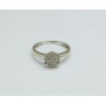 A 9ct white gold and diamond cluster ring, 2.1g, M