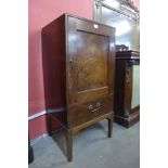 A George III mahogany single door night cupboard, 105cms h, 50cms w, 44cms d