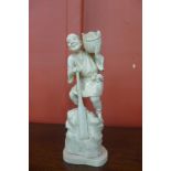 A 19th Century oriental carved ivory figure, 21cms h