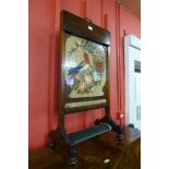 An early Victorian rosewood and embroidered fire screen, 100cms h x 51cms w