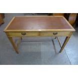 An Edward VII oak two drawer writing table, 76cms h, 122cms w, 61cms d