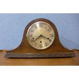 An oak mantel clock, 23cms h