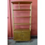 An Ercol Blonde beech and elm room divider, 191cms h x 91cms w