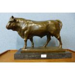 A large French style bronze figure of a bull, manner of Antoine Louis Barye, on black marble plinth,