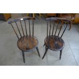 A pair of Victorian beech penny seat kitchen chairs