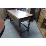 A 19th Century oak drop-leaf table