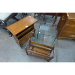 A glass occasional table and two teak magazine racks