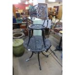 A cast alloy garden table and a chair