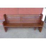 A Victorian pitch pine church pew, 84cms h, 182cms w, 55cms d